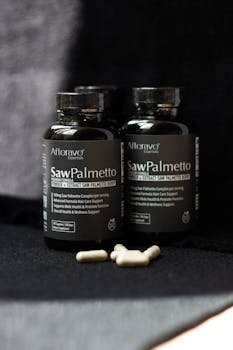 Saw Palmetto supplements for prostate and hair health support with black background.