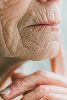 Detailed close-up of a senior adult's facial wrinkles showcasing age and skin texture.